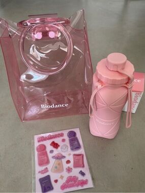 New Biodance Silicone Collapsable Water Bottle, clear Tote, & puffy sticker set